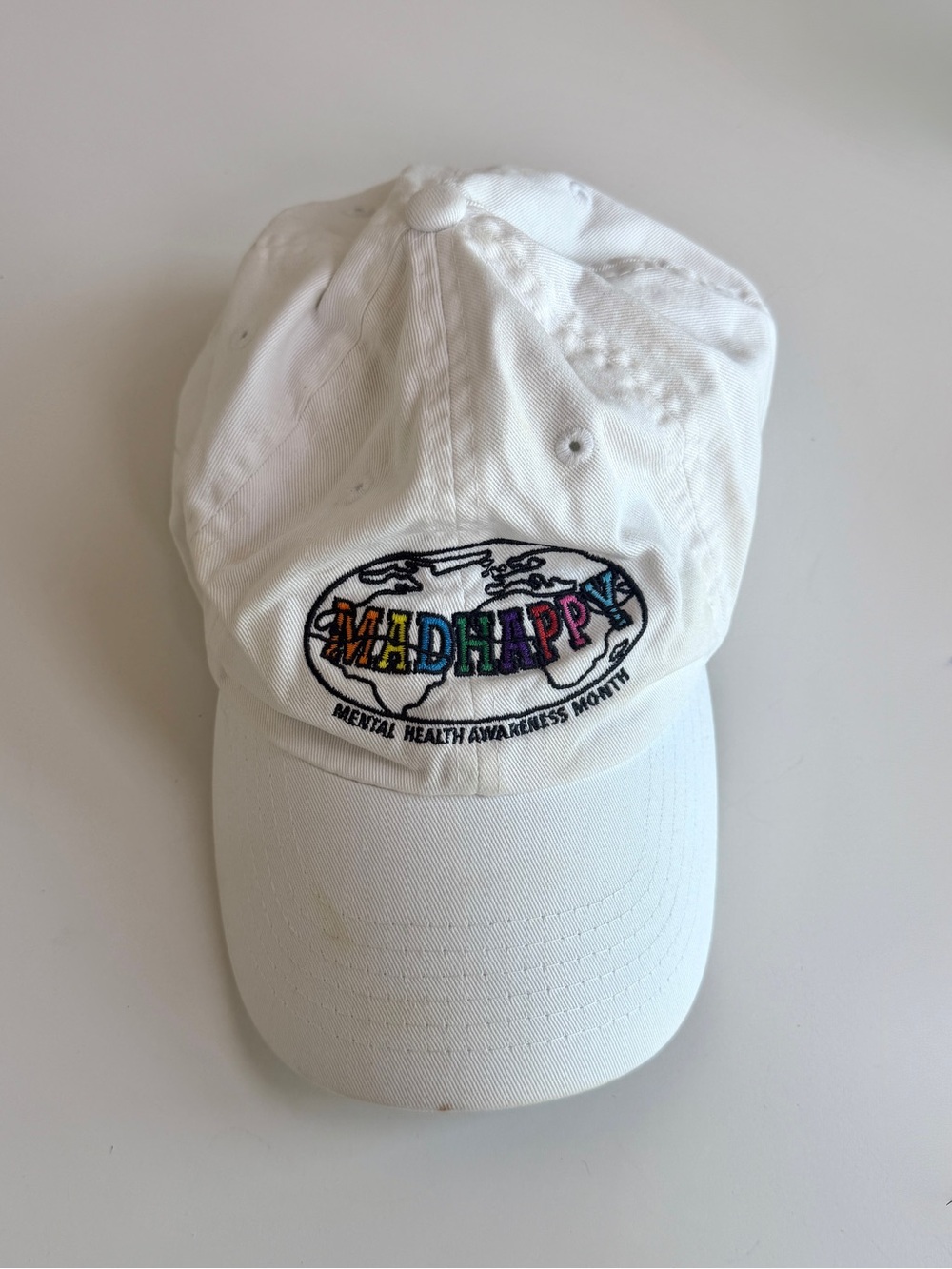 Madhappy White adjustable dad cap with Rainbow Embroidered Logo